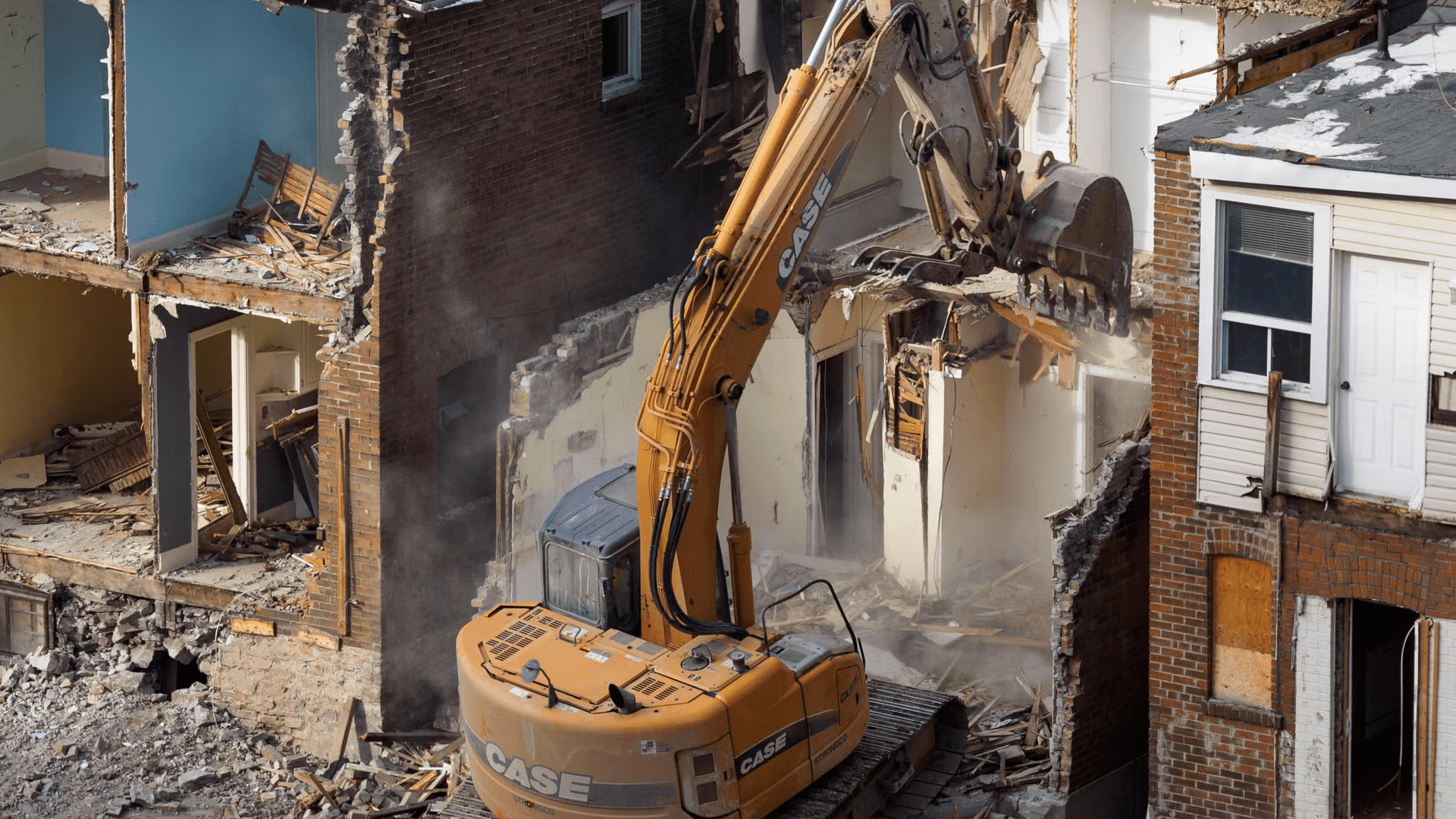 House demolition excavator on dual occupancy development site in Australia