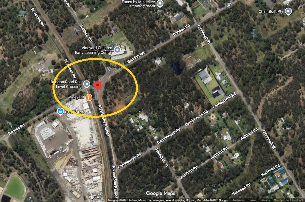 Google Maps satellite view of the Bandon Road and Riverstone Parade intersection beside Vineyard station, circled in yellow